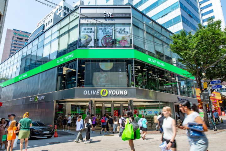 Exterior of an Olive Young store in Myeongdong with shoppers passing by