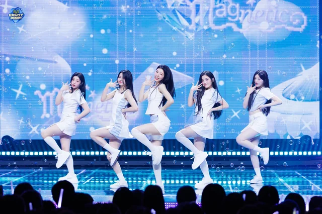 ILLIT performing Magnetic on stage during their debut promotions.