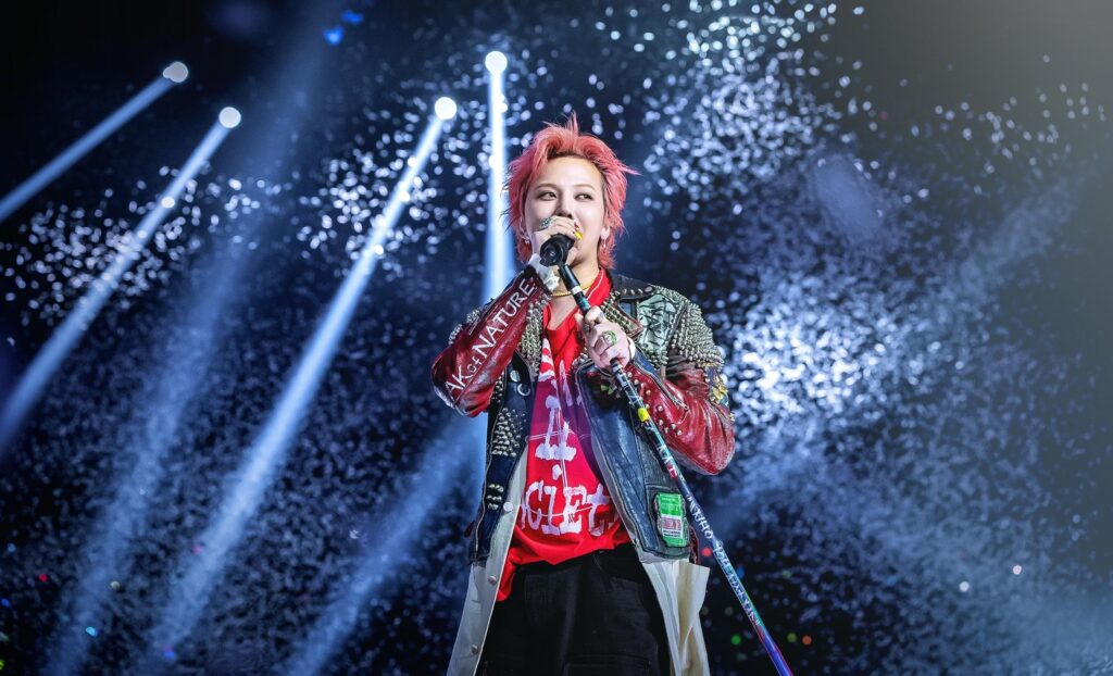 G-DRAGON performing Crooked live with a strong rock-inflected stage presence.