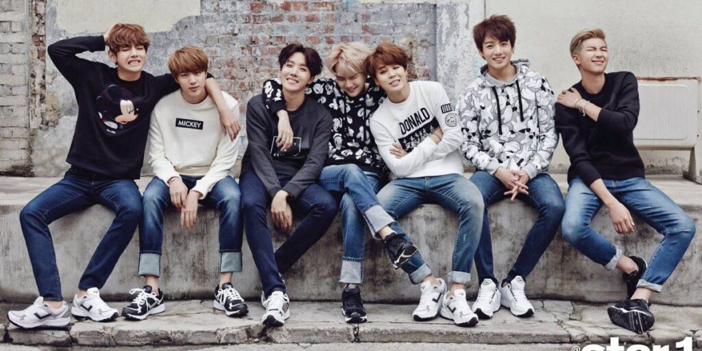 Official BTS group photo highlighting the members together as a team.