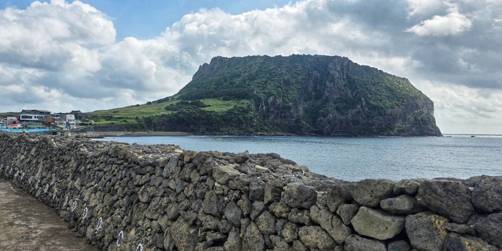 Coastal walking view with Seongsan Ilchulbong in the background